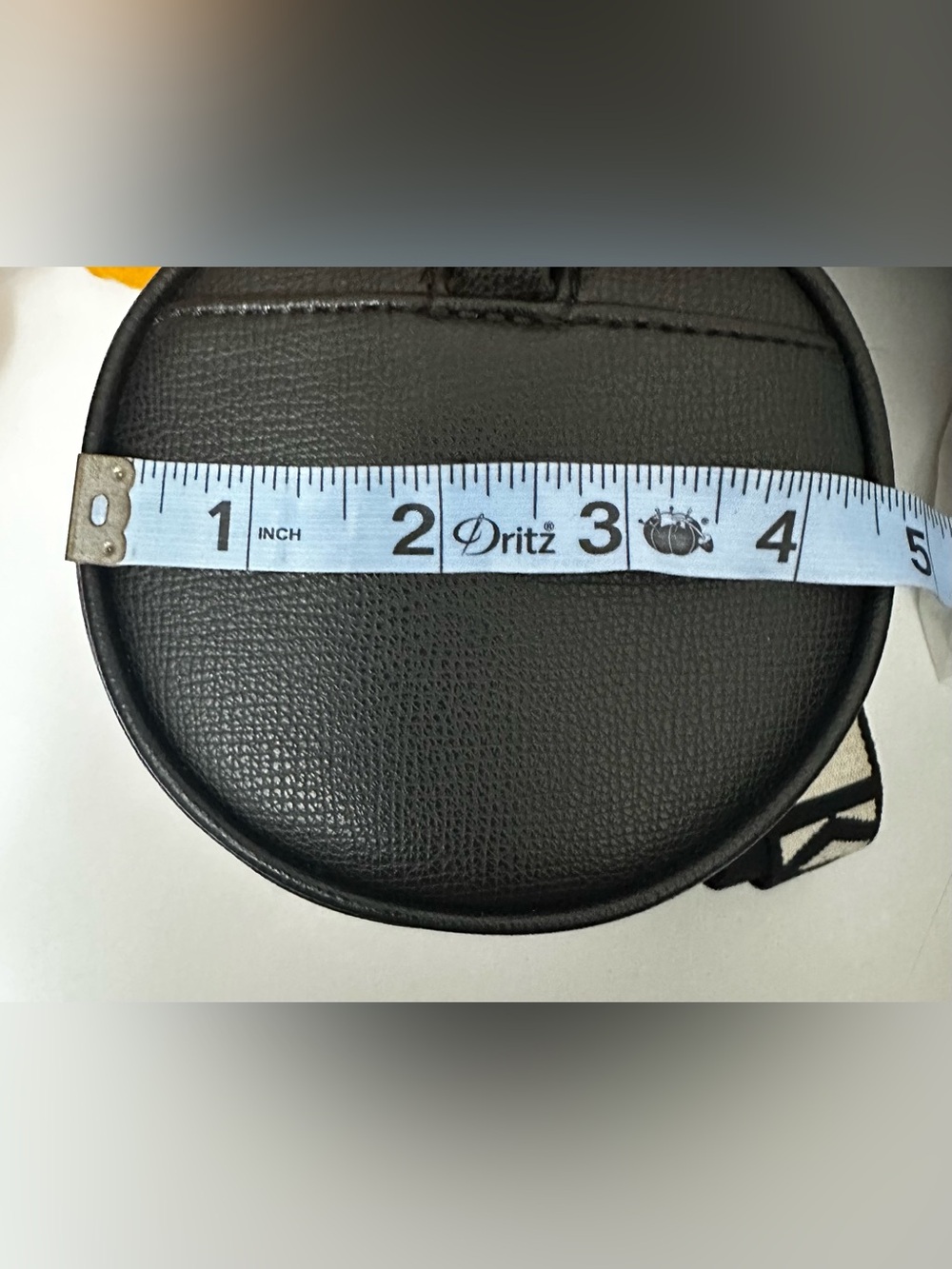 Karl Lagerfeld Paris Black Pebbled Barrel Crossbody Bag with Logo Guitar Strap - Picture 12 of 13